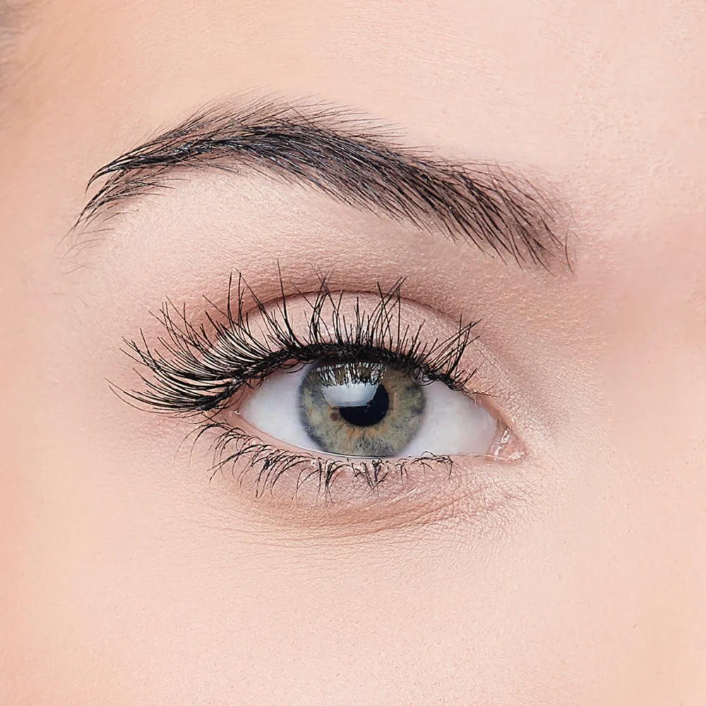 Close-up image of a woman's eye showcasing long eyelashes and a striking iris color, ideal for beauty and cosmetic products.