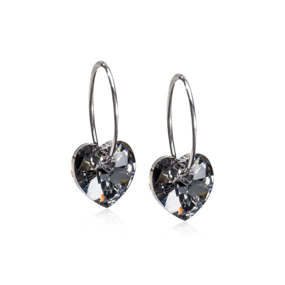 Heart-shaped crystal earrings featuring sparkling stones on a silver hoop, ideal for elegant jewelry collections.