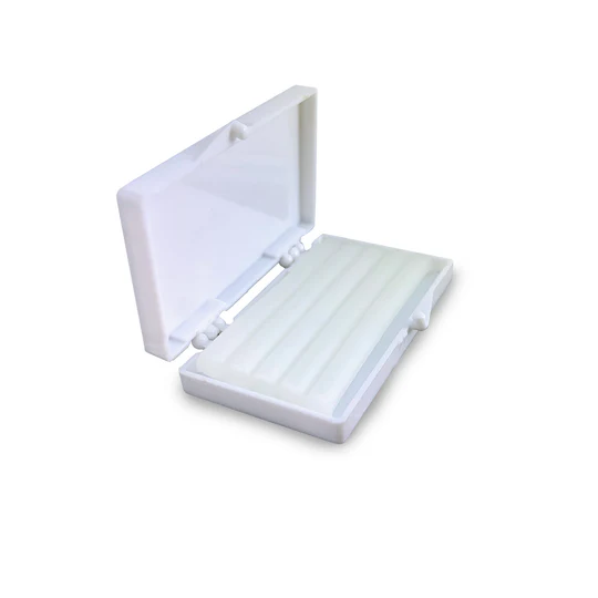 White plastic pill organizer case with multiple compartments for medication storage and organization, ideal for daily use.