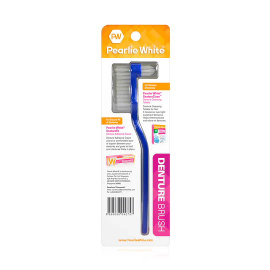 Pearly White denture brush with ergonomic handle and cleaning bristles for effective denture care, packaged in a colorful blister pack.