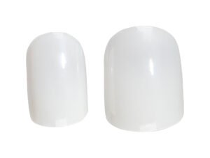 Set of white nail tips in two sizes for professional manicures and nail art applications.