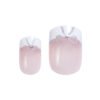 Set of pink ombre nail tips featuring white bows and glitter accents, suitable for stylish nail art applications.