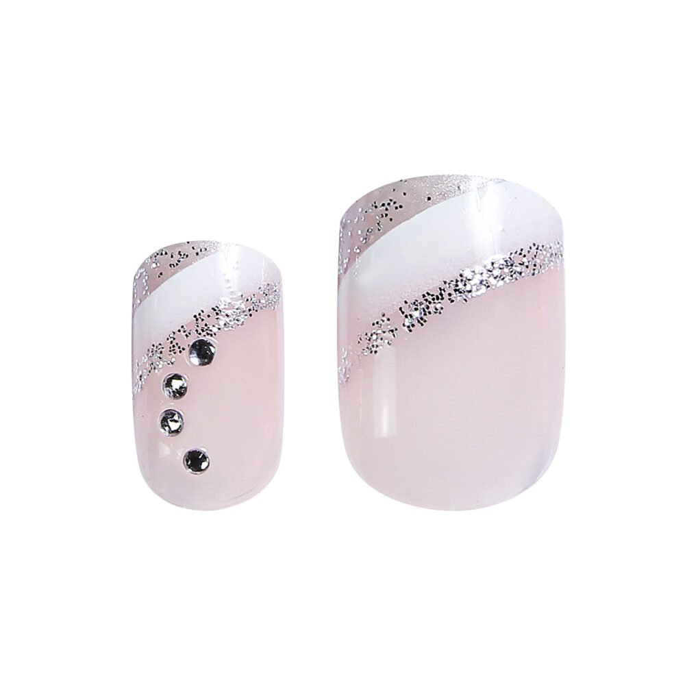 nail kit .. Stylish nail art featuring a pink base with glitter and gem accents, ideal for enhancing manicures and nail designs.