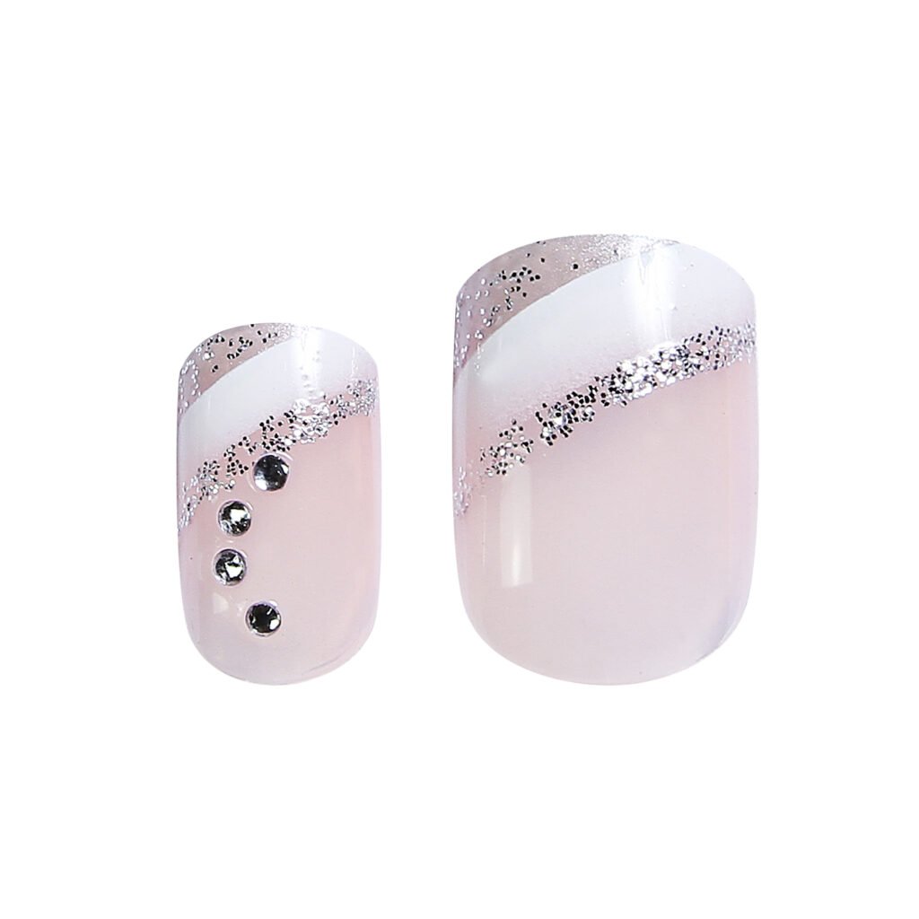 nail kit .. Stylish nail art featuring a pink base with glitter and gem accents, ideal for enhancing manicures and nail designs.