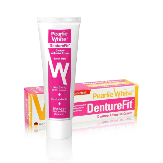 Pearly White DentureFit denture adhesive cream tube with fresh mint flavor, designed for strong hold on wet and dry dentures.