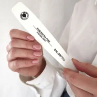 SalonPro extra fine nail file with 240/280 grit held in hand, designed for smooth nail shaping and finishing.