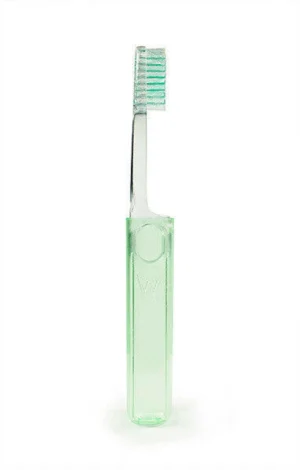 Green plastic toothbrush with soft bristles, ideal for effective oral hygiene and daily dental care. Lightweight and ergonomic design.