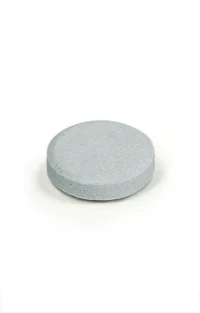 Gray round tablet supplement for health and wellness, designed for easy consumption and effective nutrient delivery.