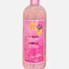 So White Exfoliating Shower Gel in a 500ml bottle with pink exfoliating beads, designed for gentle cleansing and exfoliation.