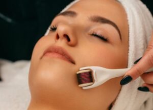 derma roller .. Person in Gray Hoodie Holding White Toothbrush